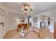 Open dining area with a view into the kitchen, featuring hardwood floors and modern decor at 6 Montana Way, Henderson, NV 89015