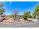 Charming single-story home with desert landscaping and a covered porch, perfect for relaxing outdoors at 6 Montana Way, Henderson, NV 89015