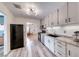 Well-lit kitchen featuring stainless steel appliances, modern cabinets, and wood floors offering a great space for cooking at 6 Montana Way, Henderson, NV 89015