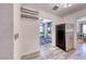 Galley kitchen with stainless steel refrigerator next to dining area offers lots of natural light at 6 Montana Way, Henderson, NV 89015