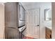 Convenient laundry area with stacked washer and dryer, storage, and a modern vanity at 6 Montana Way, Henderson, NV 89015
