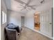 View of a naturally lit living room with tiled floor, white walls, and a cozy sofa at 6 Montana Way, Henderson, NV 89015
