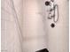 Close-up of the tiled shower stall with a black shower head and toiletry caddy at 6 Montana Way, Henderson, NV 89015