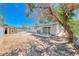Home backyard with shed, patio, and side yard, ready for personalized landscaping at 6204 Parsifal Pl, Las Vegas, NV 89107