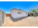 Backyard of home with covered patio, shed, and cinderblock fencing for added privacy at 6204 Parsifal Pl, Las Vegas, NV 89107