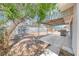 Backyard with patio, grill, shed, and cinderblock wall for privacy and fencing at 6204 Parsifal Pl, Las Vegas, NV 89107