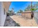 Home's spacious backyard featuring a shed, covered patio, and perimeter block wall at 6204 Parsifal Pl, Las Vegas, NV 89107