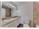 Bathroom featuring a vanity with drawers, an oversized mirror, and modern vanity lighting at 6204 Parsifal Pl, Las Vegas, NV 89107
