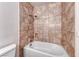 Bathtub with tiled walls and a shower head in the bathroom at 6204 Parsifal Pl, Las Vegas, NV 89107