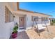 Welcome home to this freshly painted house with a porch swing at 6204 Parsifal Pl, Las Vegas, NV 89107
