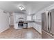 Open kitchen area with stainless steel appliances and ample cabinet space at 6204 Parsifal Pl, Las Vegas, NV 89107