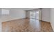 Spacious living room with tiled floor and sliding doors at 6204 Parsifal Pl, Las Vegas, NV 89107
