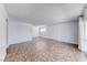 Tile floors and bright white walls are in this open-concept living room at 6204 Parsifal Pl, Las Vegas, NV 89107