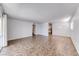 Open-concept living space with neutral walls and tile flooring at 6204 Parsifal Pl, Las Vegas, NV 89107