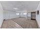 Bright bedroom with large windows, carpet floors, closet space, and neutral-colored walls at 6204 Parsifal Pl, Las Vegas, NV 89107