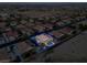 Aerial view of the property nestled in a residential neighborhood, featuring a pool and RV parking at 6245 Galileo Dr, Las Vegas, NV 89149