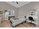 Vaulted ceilings and white furniture accent this quaint bedroom with lots of natural light and a vanity at 6245 Galileo Dr, Las Vegas, NV 89149