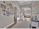 View of the foyer with hardwood floors, neutral walls, pictures, and decor at 6245 Galileo Dr, Las Vegas, NV 89149