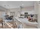 Eat in kitchen with a center island, white cabinets, and hardwood floors at 6245 Galileo Dr, Las Vegas, NV 89149