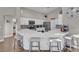 Eat-in kitchen featuring quartz countertops, a large island, and stainless steel appliances at 6245 Galileo Dr, Las Vegas, NV 89149