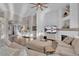 Inviting living room with a stone fireplace, hardwood floors, vaulted ceilings, and neutral paint at 6245 Galileo Dr, Las Vegas, NV 89149