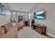 Inviting living room featuring a large sectional sofa, decor and a wall-mounted TV for entertainment at 6245 Galileo Dr, Las Vegas, NV 89149