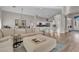 Spacious living area featuring an open floor plan, hardwood floors, and neutral paint at 6245 Galileo Dr, Las Vegas, NV 89149