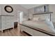 Bright and airy main bedroom with a comfortable bed, dresser, and light gray walls at 6245 Galileo Dr, Las Vegas, NV 89149