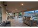 Spacious covered outdoor kitchen featuring a built-in BBQ, and mountain views at 6245 Galileo Dr, Las Vegas, NV 89149