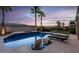 Stunning backyard pool with a spa area, complete with lounge chairs and desert landscape at 6245 Galileo Dr, Las Vegas, NV 89149