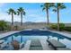 Backyard featuring an inviting pool, mountain views, and sun loungers at 6245 Galileo Dr, Las Vegas, NV 89149