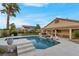 Backyard featuring a pool, covered patio, and ample lounge space at 6245 Galileo Dr, Las Vegas, NV 89149