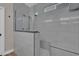 Modern walk-in shower features gray subway tiles, a glass enclosure, and a built-in bench at 6245 Galileo Dr, Las Vegas, NV 89149
