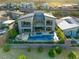 Aerial view of backyard with pool, spa, and outdoor seating area at 6570 Aurora View St, Las Vegas, NV 89135