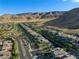 A picturesque community nestled amidst rolling hills, showcasing a harmonious blend of homes at 6570 Aurora View St, Las Vegas, NV 89135
