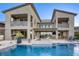 Luxury home backyard features a swimming pool, jacuzzi and outdoor seating at 6570 Aurora View St, Las Vegas, NV 89135