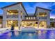 Gorgeous backyard pool featuring a waterfall feature and outdoor kitchen, perfect for entertaining at 6570 Aurora View St, Las Vegas, NV 89135