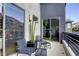 Inviting balcony featuring comfortable seating and sleek railings, perfect for outdoor relaxation and views at 6570 Aurora View St, Las Vegas, NV 89135