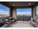 Expansive balcony with comfortable seating and panoramic views of the city skyline at 6570 Aurora View St, Las Vegas, NV 89135