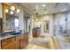 Modern bathroom with a spacious shower and dual vanities at 6570 Aurora View St, Las Vegas, NV 89135