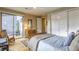 Well-lit bedroom features an outdoor view and patio access, offering a serene retreat at 6570 Aurora View St, Las Vegas, NV 89135