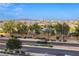 Expansive city view with lush green trees, captured from the balcony of this wonderful property at 6570 Aurora View St, Las Vegas, NV 89135