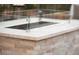 Modern fire pit on a stone patio creates a relaxing outdoor space at 6570 Aurora View St, Las Vegas, NV 89135