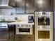 Close up of gourmet kitchen featuring stainless steel oven, microwave and coffee maker at 6570 Aurora View St, Las Vegas, NV 89135