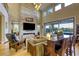 Open-concept living room with stone fireplace, hardwood floors, and seamless indoor-outdoor transition at 6570 Aurora View St, Las Vegas, NV 89135