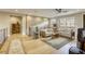 Cozy living room with stone wall and abundant natural light at 6570 Aurora View St, Las Vegas, NV 89135