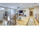 Upstairs living room boasts wood floors, modern furniture, and natural light at 6570 Aurora View St, Las Vegas, NV 89135