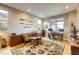 Home office with natural light, a comfortable couch, and ample desk space at 6570 Aurora View St, Las Vegas, NV 89135