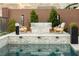Inviting outdoor pool area with comfortable seating and a stylish fire pit at 6570 Aurora View St, Las Vegas, NV 89135