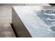 A modern pool with a waterfall feature adds a touch of luxury to this property at 6570 Aurora View St, Las Vegas, NV 89135